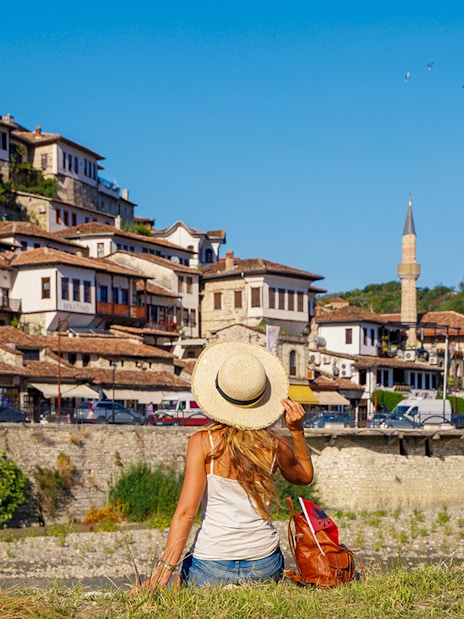 Guests exploring Berat's historic hillside houses and mosque.