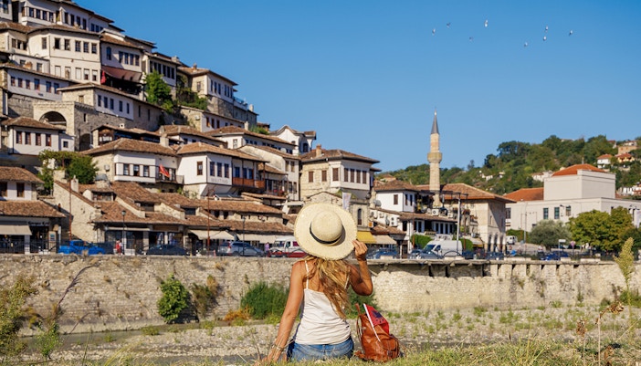 Guests exploring Berat's historic hillside houses and mosque.