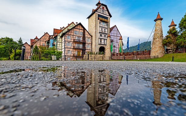 Colmar Tropicale medieval village with half-timbered buildings and stone towers, Malaysia.