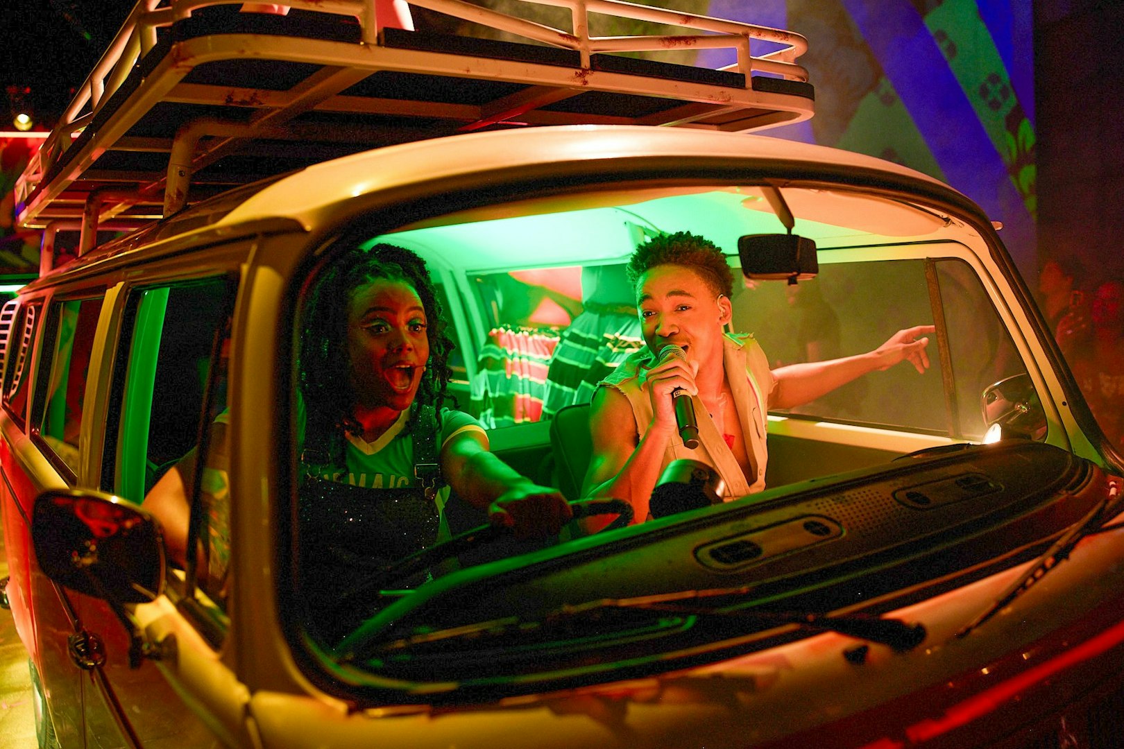 Performers singing inside a van during Bob Marley The Show in Las Vegas.
