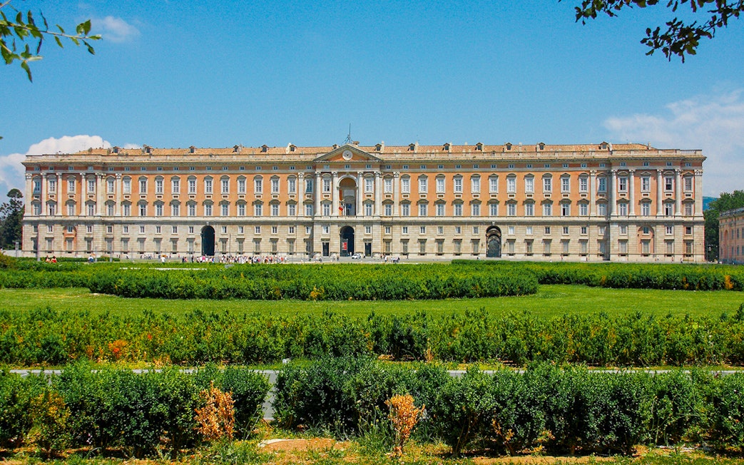 Royal Palace of Caserta facade with gardens, Italy.