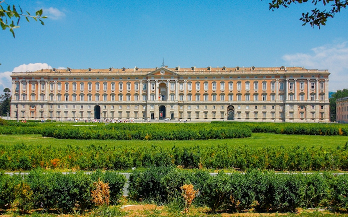 Royal Palace of Caserta facade with gardens, Italy.