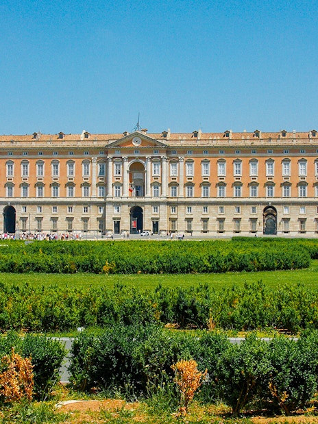 Royal Palace of Caserta facade with gardens, Italy.
