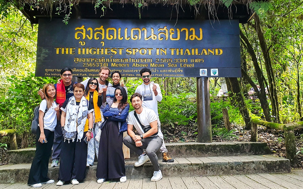 Tourists gather at "The Highest Spot in Thailand" sign, Doi Inthanon National Park.