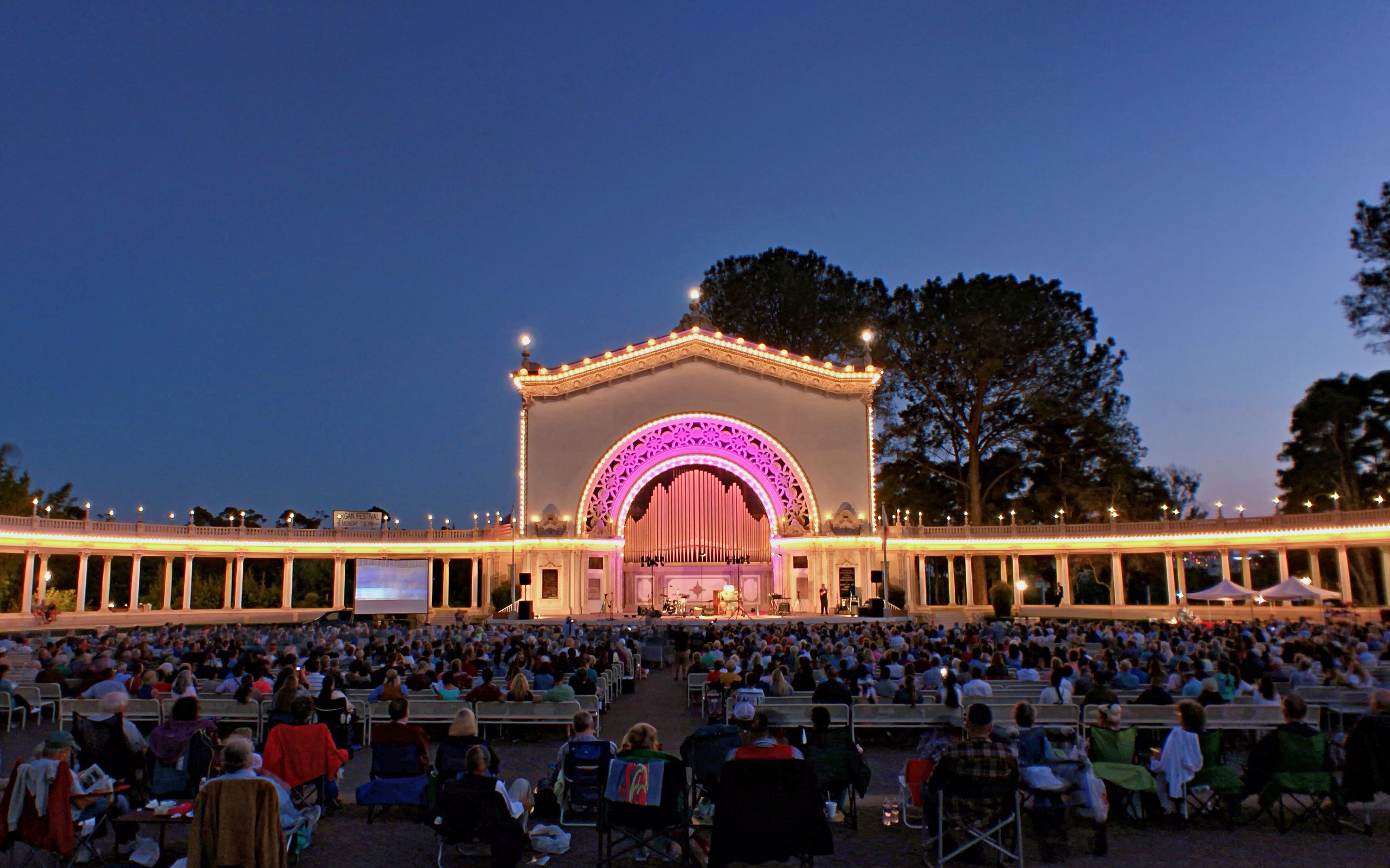 Night concert at Spreckels Organ Pavilion, Balboa Park, San Diego, with audience seated.