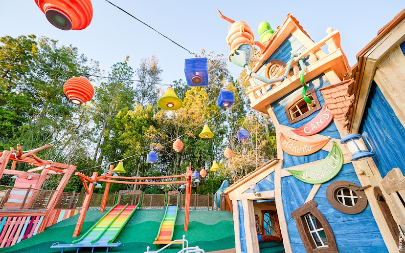 Colorful slides and whimsical building in Mickey's Toontown at Disneyland Park, California.
