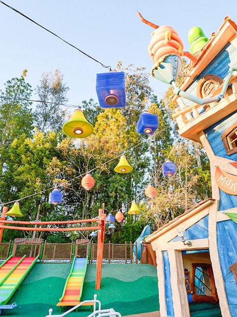 Colorful slides and whimsical building in Mickey's Toontown at Disneyland Park, California.