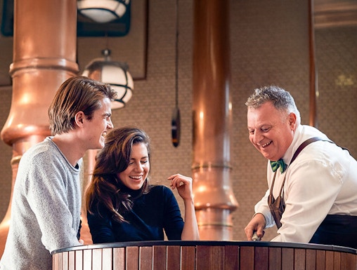 Visitors enjoying a tour at the Heineken Experience brewery in Amsterdam.