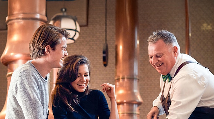 Visitors enjoying a tour at the Heineken Experience brewery in Amsterdam.