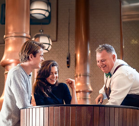 Visitors enjoying a tour at the Heineken Experience brewery in Amsterdam.