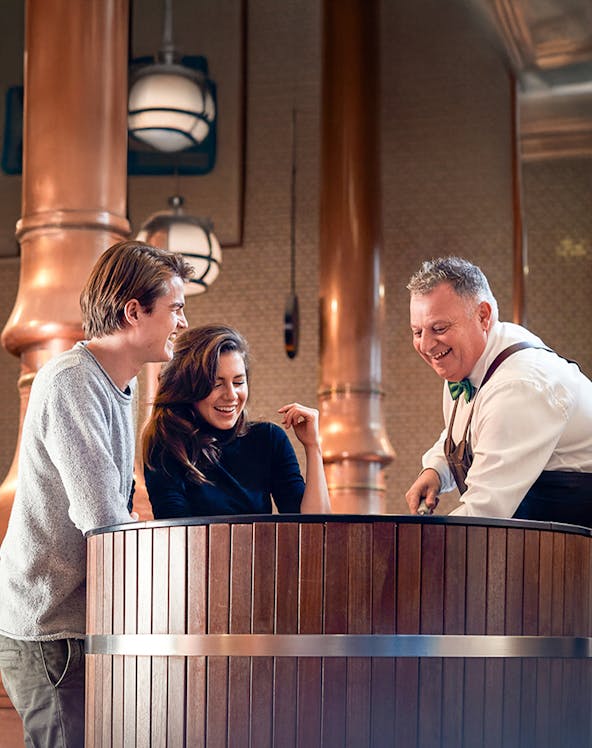 Visitors enjoying a tour at the Heineken Experience brewery in Amsterdam.