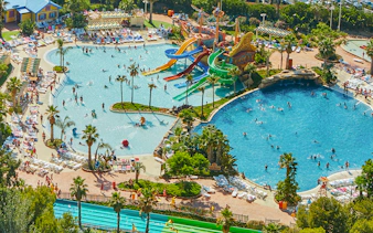 Aerial view of Caribe Aquatic Park with colorful water slides and swimming pools.