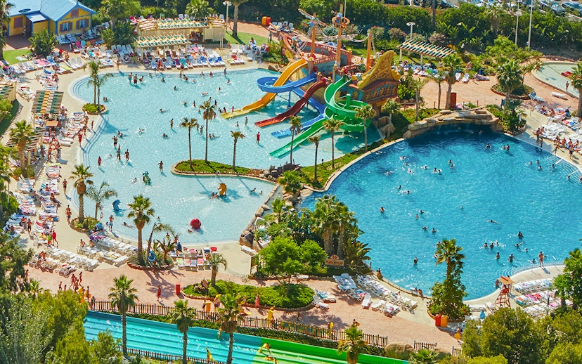 Aerial view of Caribe Aquatic Park with colorful water slides and swimming pools.