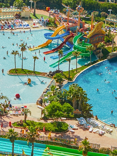 Aerial view of Caribe Aquatic Park with colorful water slides and swimming pools.