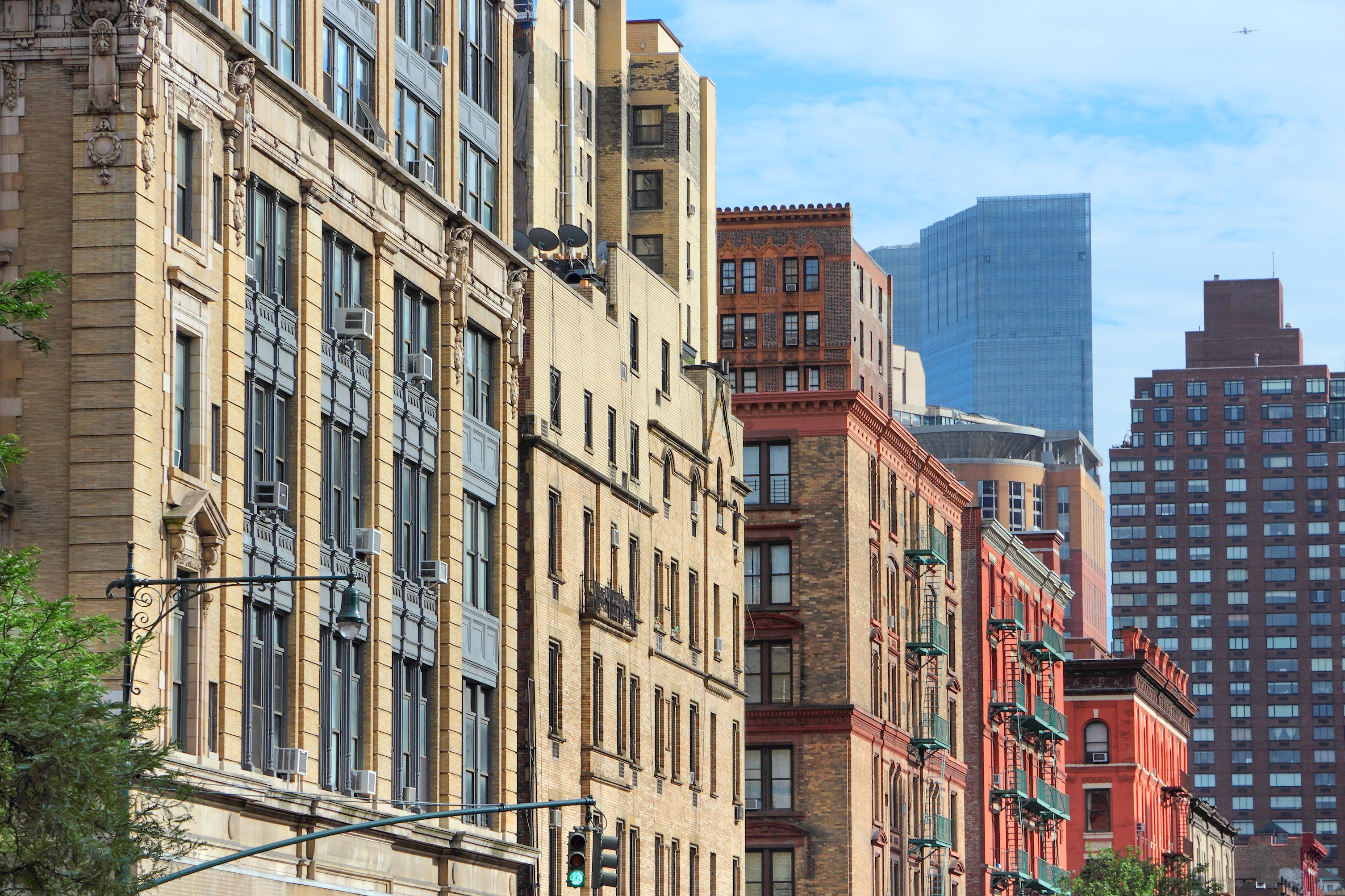 Historic buildings along Columbus Avenue with modern skyscrapers in the background.