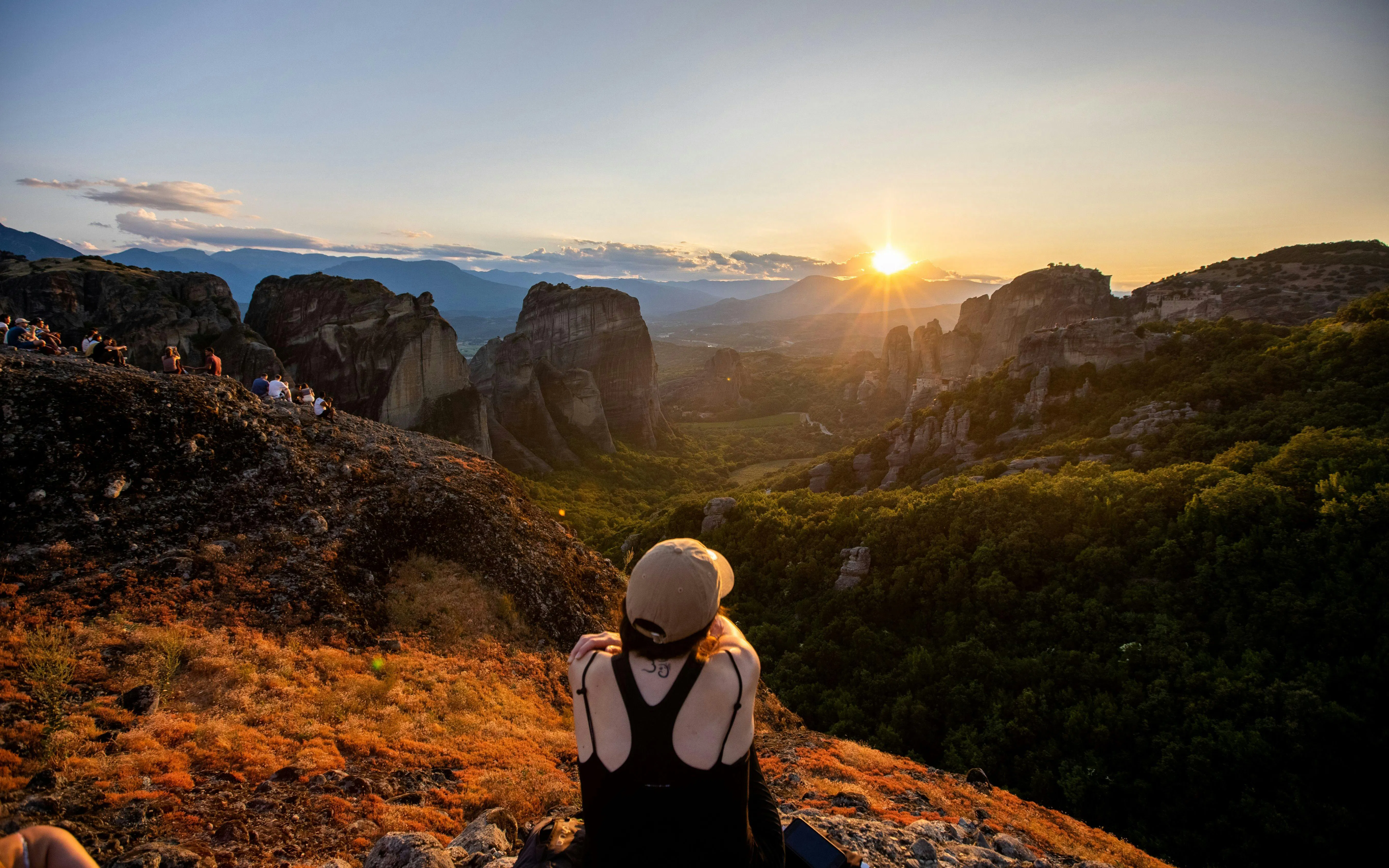 Sunset view over Meteora rock formations from a hilltop near Athens.