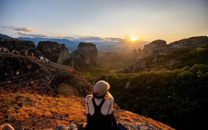 Sunset view over Meteora rock formations from a hilltop near Athens.