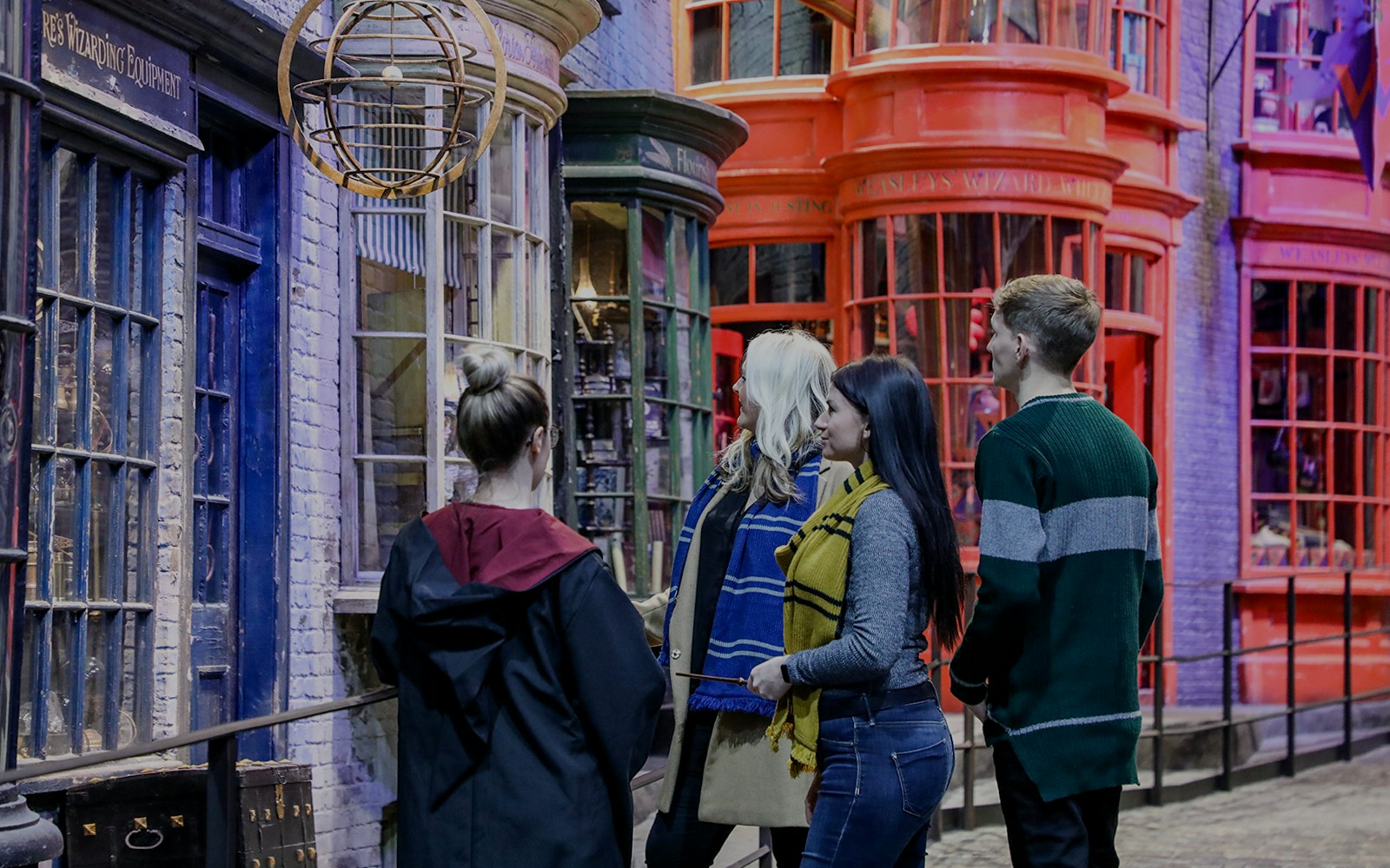 Tourists exploring Diagon Alley at Warner Bros. Studio, London.