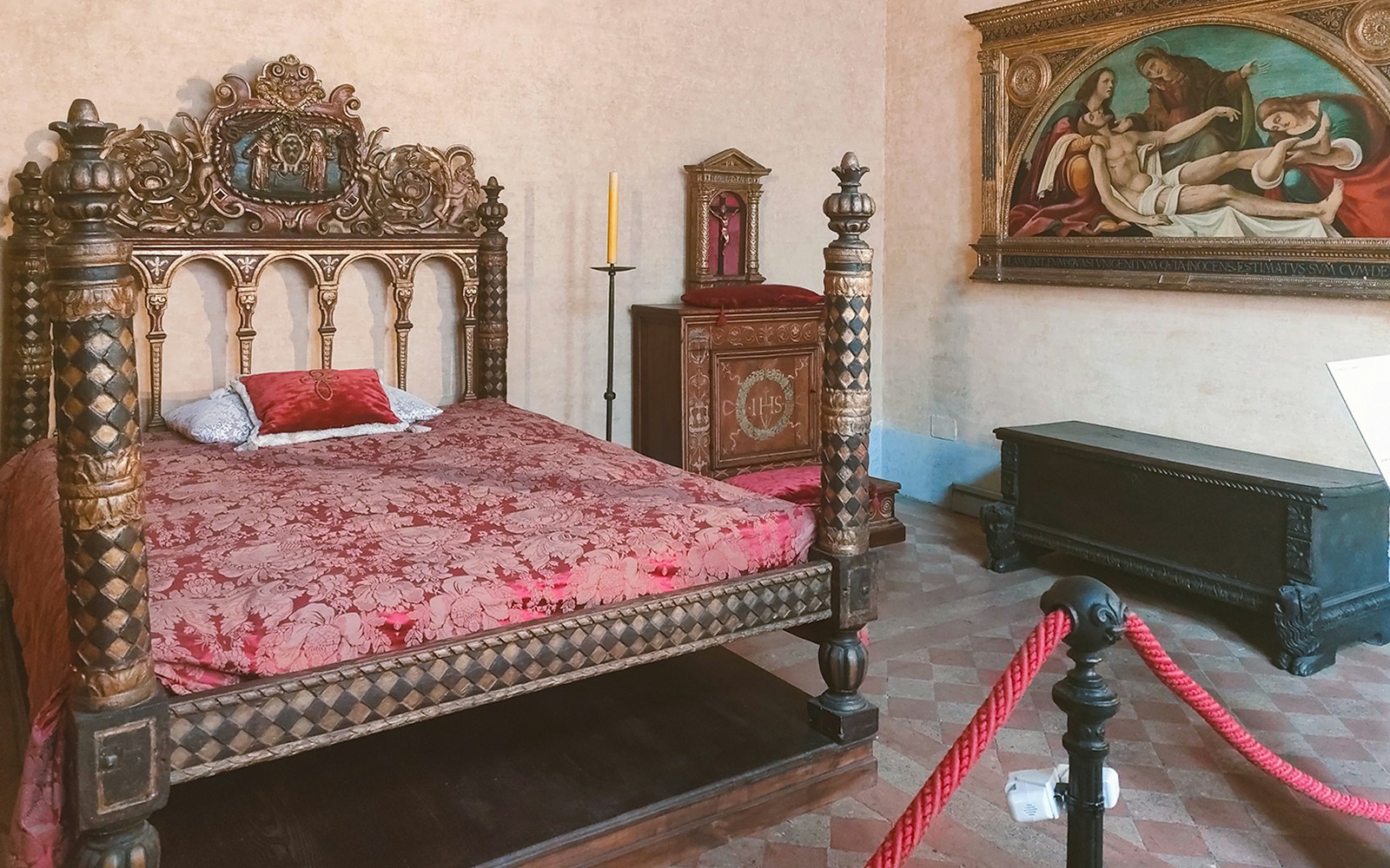 Ornate bedroom with carved bed in Castel Sant'Angelo, Rome.