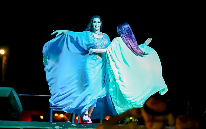 Belly dancers performing on stage in Dubai.