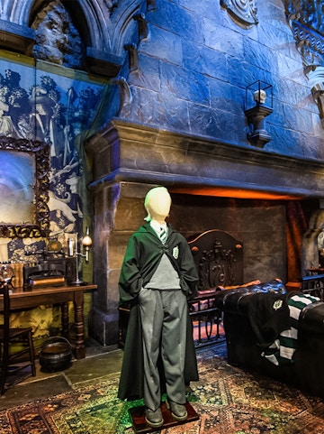 Draco Malfoy costume in Slytherin common room on Harry Potter London tour.