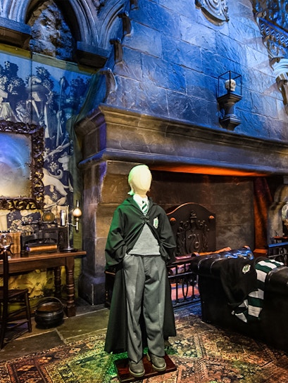 Draco Malfoy costume in Slytherin common room on Harry Potter London tour.