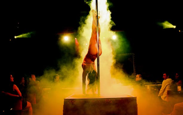 Performer on stage during X Burlesque - Kick'n Topless Revue, Vegas.