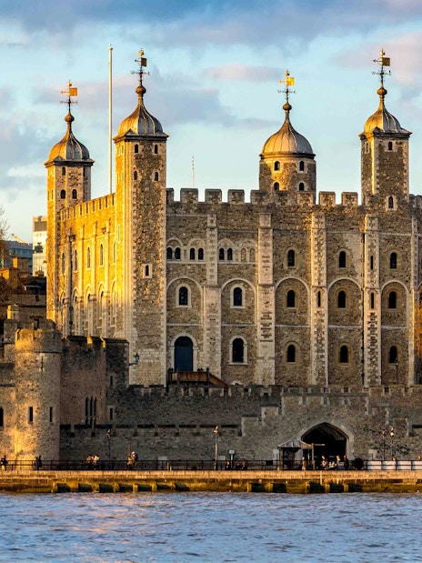 Tower of London with river view at sunset, England, UK.