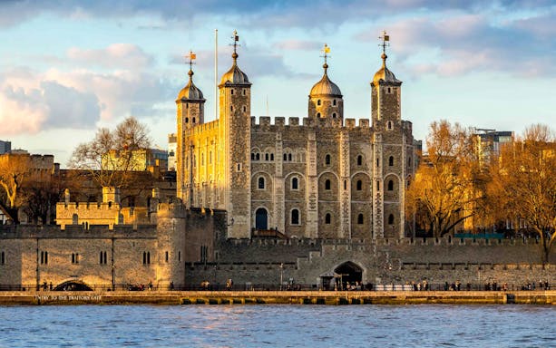 Tower of London with river view at sunset, England, UK.