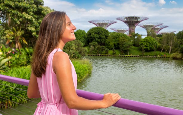 Person enjoying the view of Supertree Grove at Gardens by the Bay, Singapore.