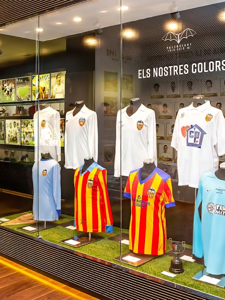 Valencia CF jerseys displayed at Mestalla Forevertour exhibit in Valencia.