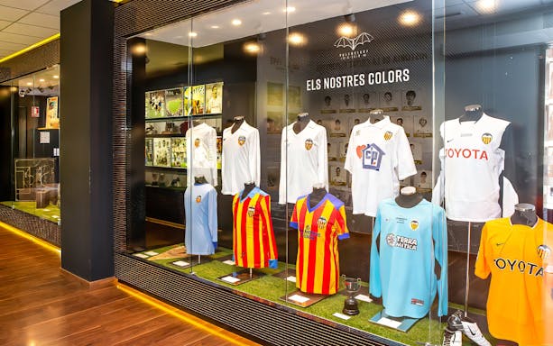 Valencia CF jerseys displayed at Mestalla Forevertour exhibit in Valencia.