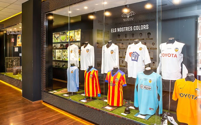 Valencia CF jerseys displayed at Mestalla Forevertour exhibit in Valencia.