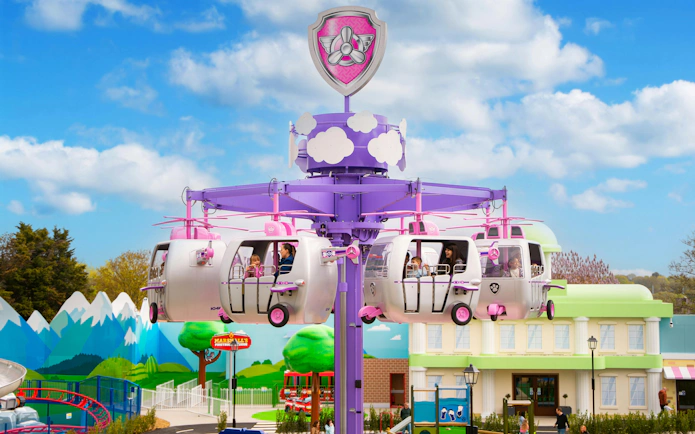 Riders enjoying the Paw Patrol themed ride at Chessington World of Adventures.