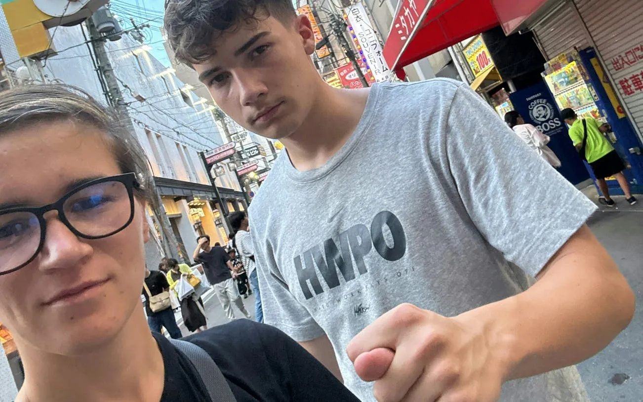 Exploring Dotonbori street in Osaka during a self-guided food origins game.
