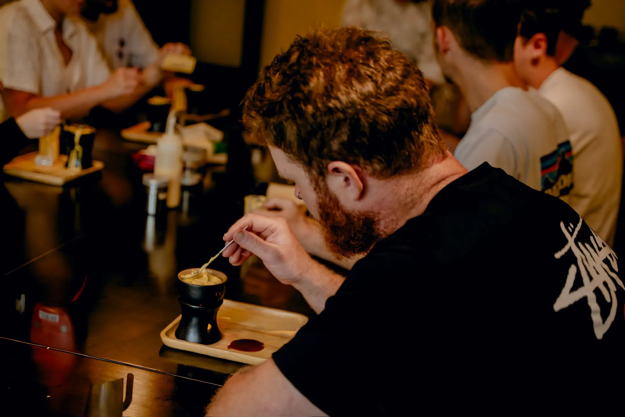 Participants crafting coffee in a workshop in Da Nang.