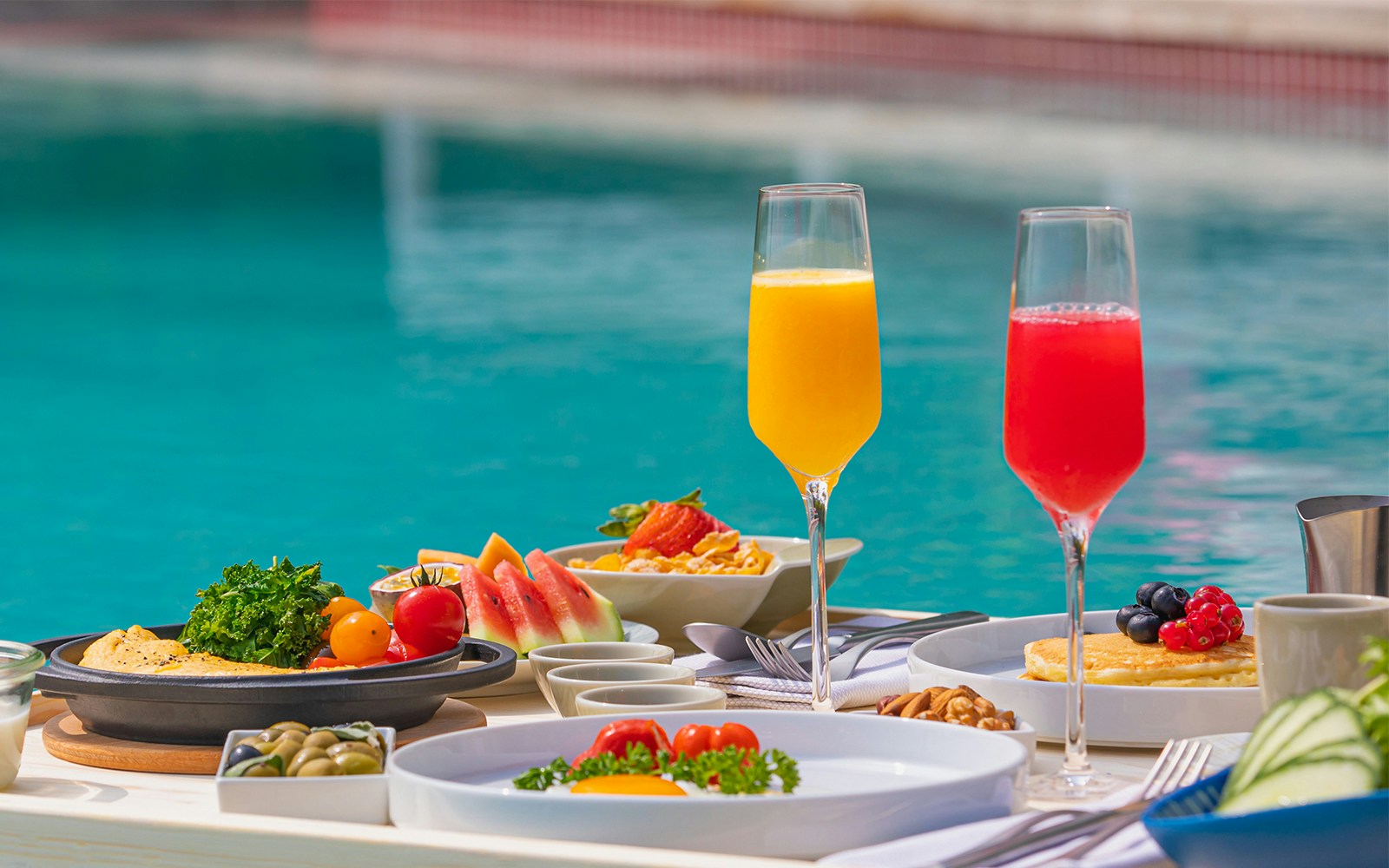 Breakfast in swimming pool, floating breakfast in luxurious tropical resort.