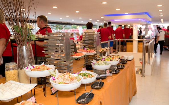 Buffet setup on Meridian Dinner Cruise with various salads and dishes.