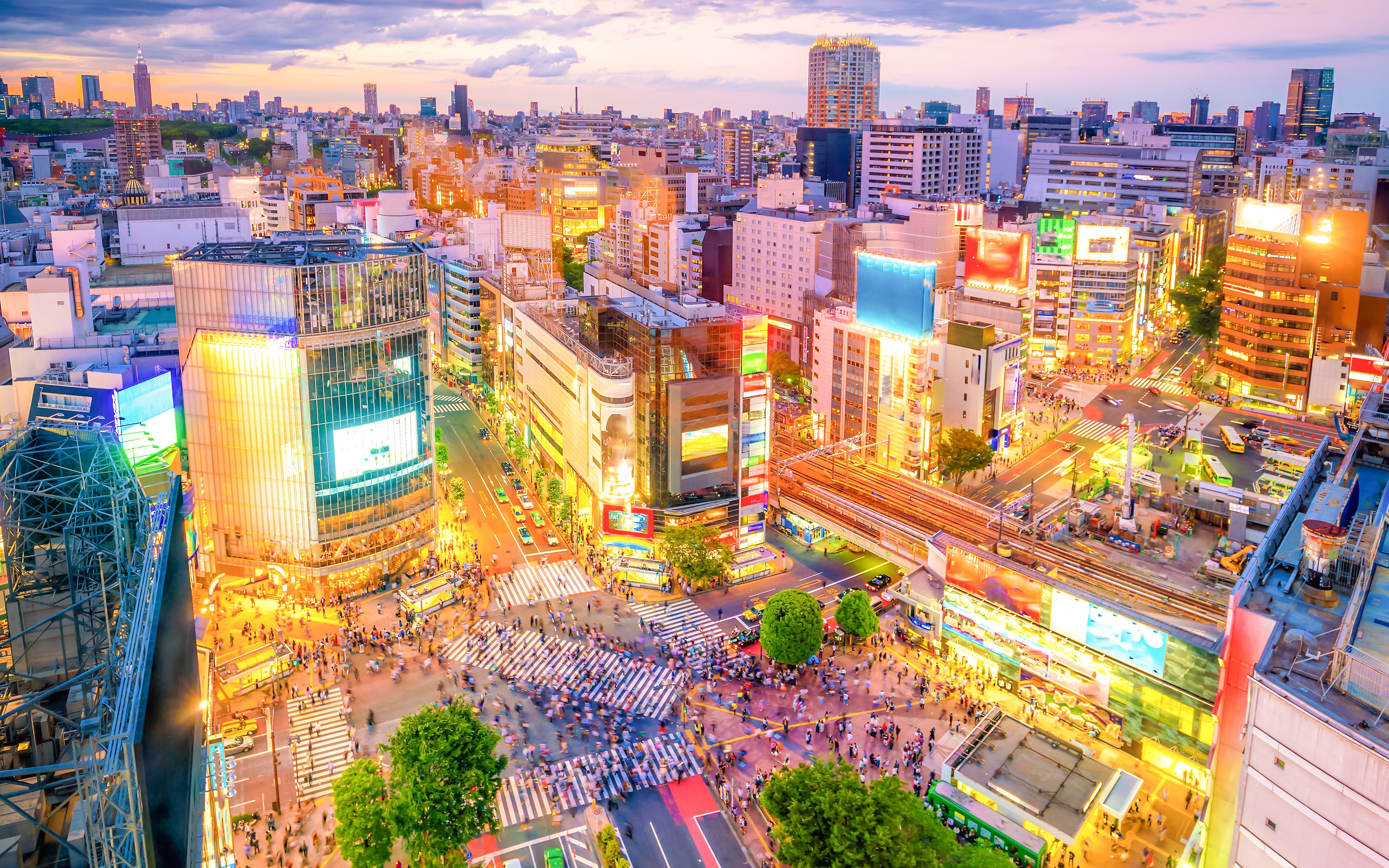 Shibuya Crossing bustling with pedestrians from a top view in Tokyo.