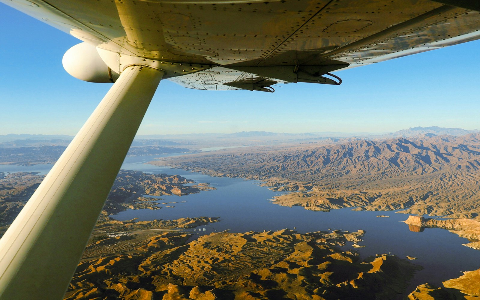 Airplane flying over Grand Canyon with Hummer tour in Nevada, USA.