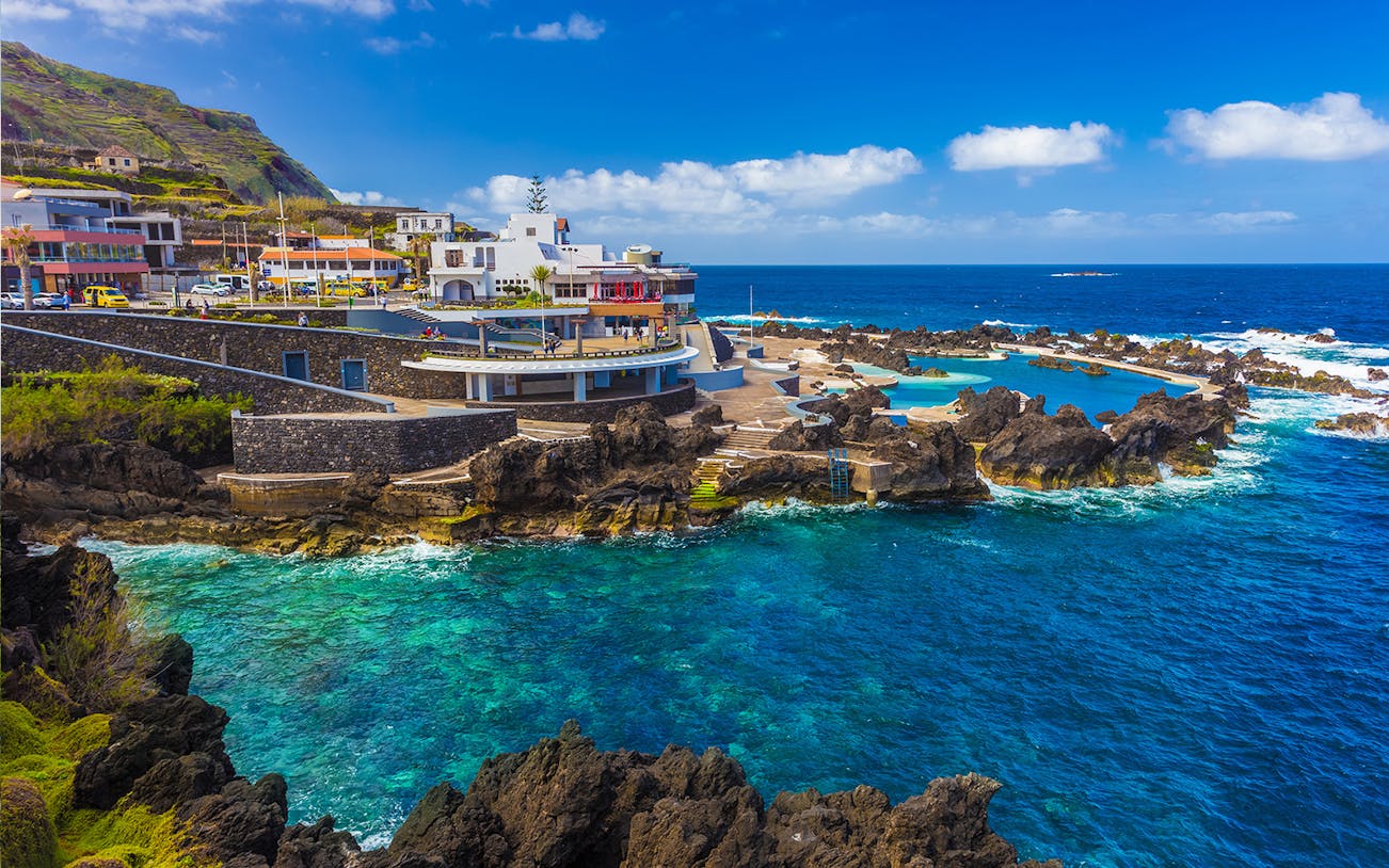 Natural swimming pools and rocky coastline in Porto Moniz, Madeira.