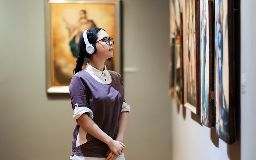 Person viewing artwork in Galleria Corsini, Rome.