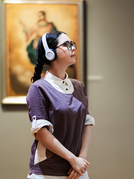 Person viewing artwork in Galleria Corsini, Rome.