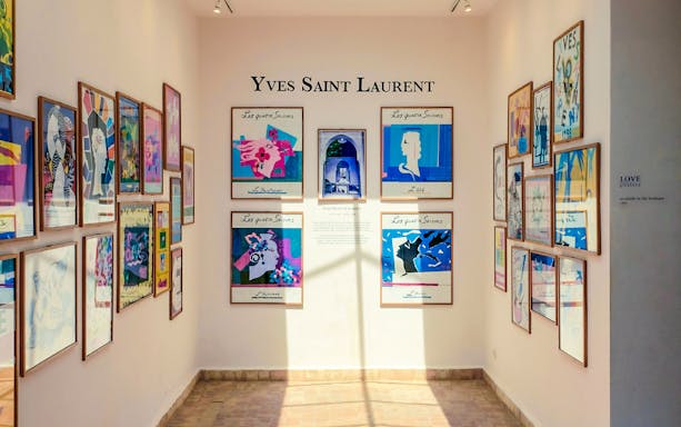Yves Saint Laurent art gallery with colorful framed posters at Marrakesh Museum.