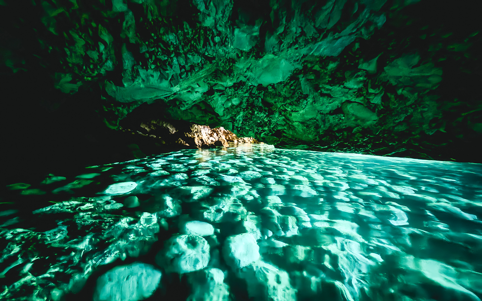 Blue cave interior with turquoise water reflections, Albania.