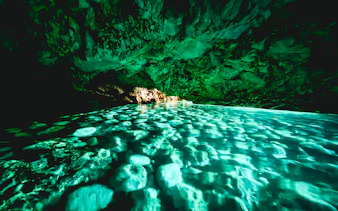 Blue cave interior with turquoise water reflections, Albania.