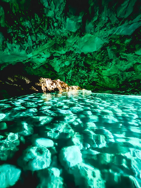Blue cave interior with turquoise water reflections, Albania.