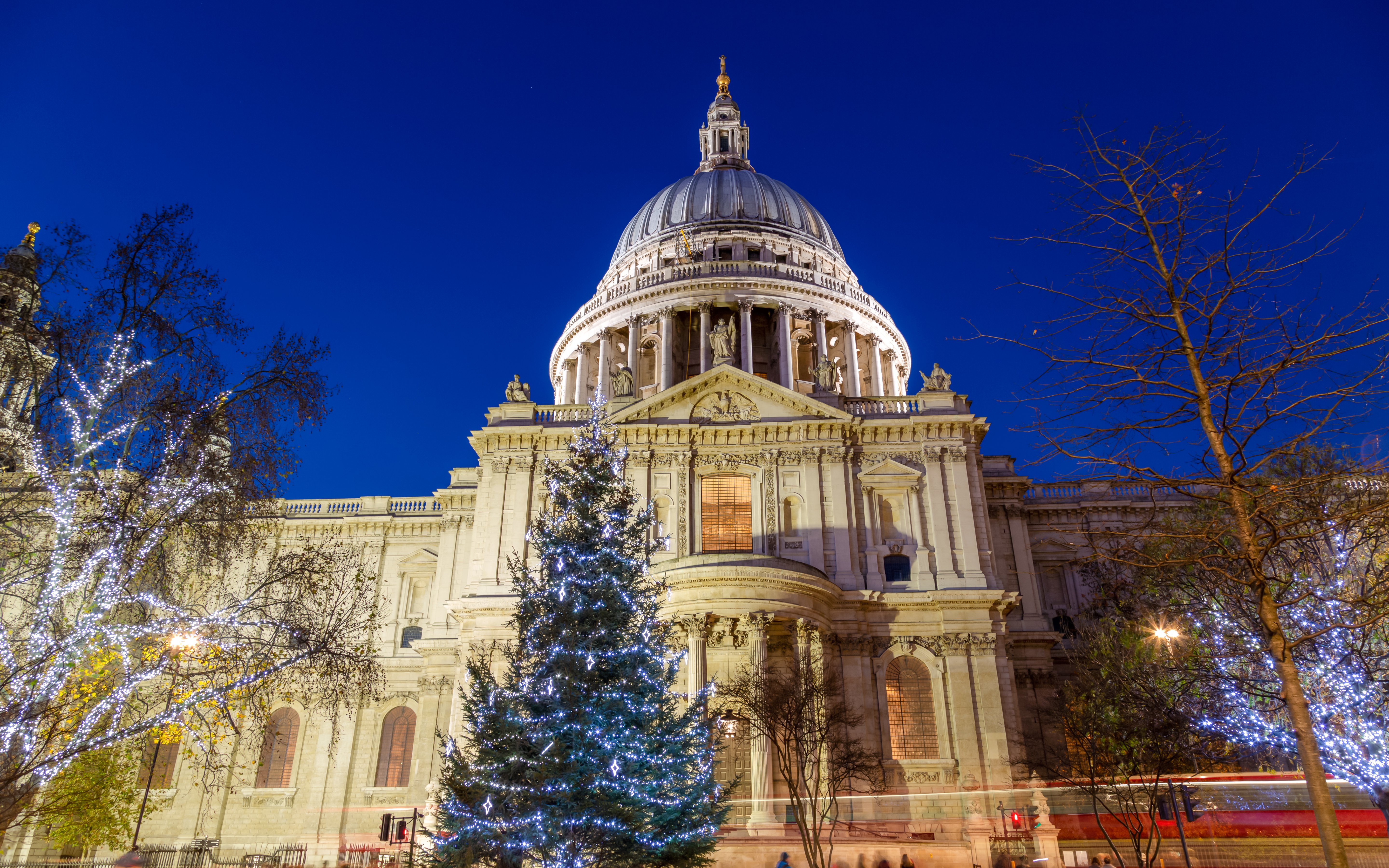 St Paul’s Cathedral in London with Christmas lights and decorated trees.