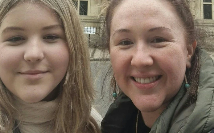 Two people smiling during the Oxford Time Thief self-guided city exploration game.