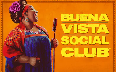 Singer performing with a microphone, Buena Vista Social Club text.
